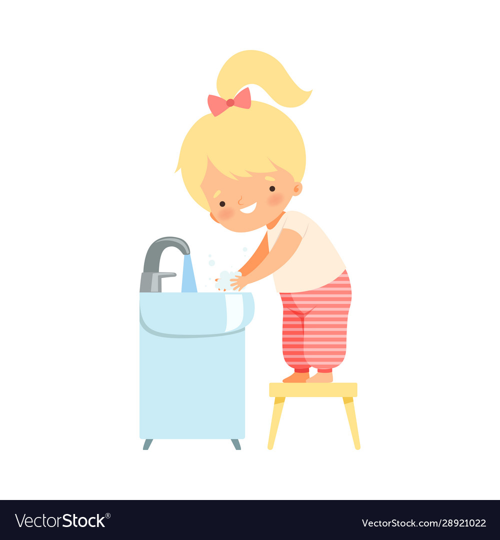 Little girl holding soap washing her hands