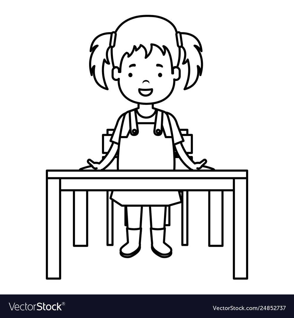 Little girl studying in school desk