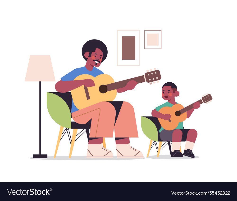 Father teaching little son to play guitar