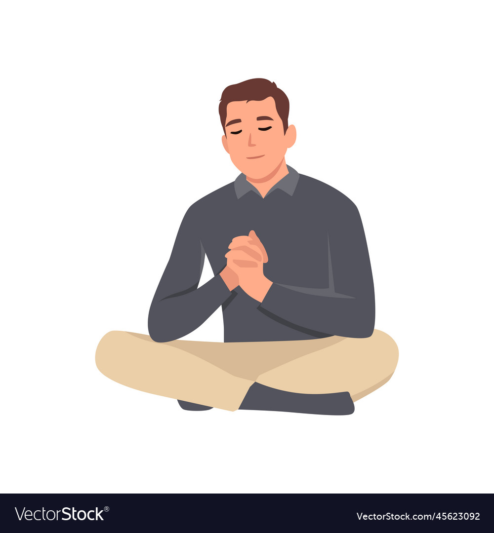 Young happy man pray to god while sit on the floor