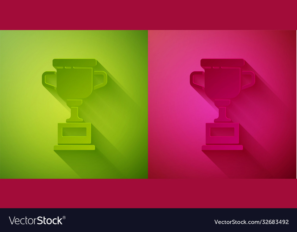 Paper cut award cup icon isolated on green