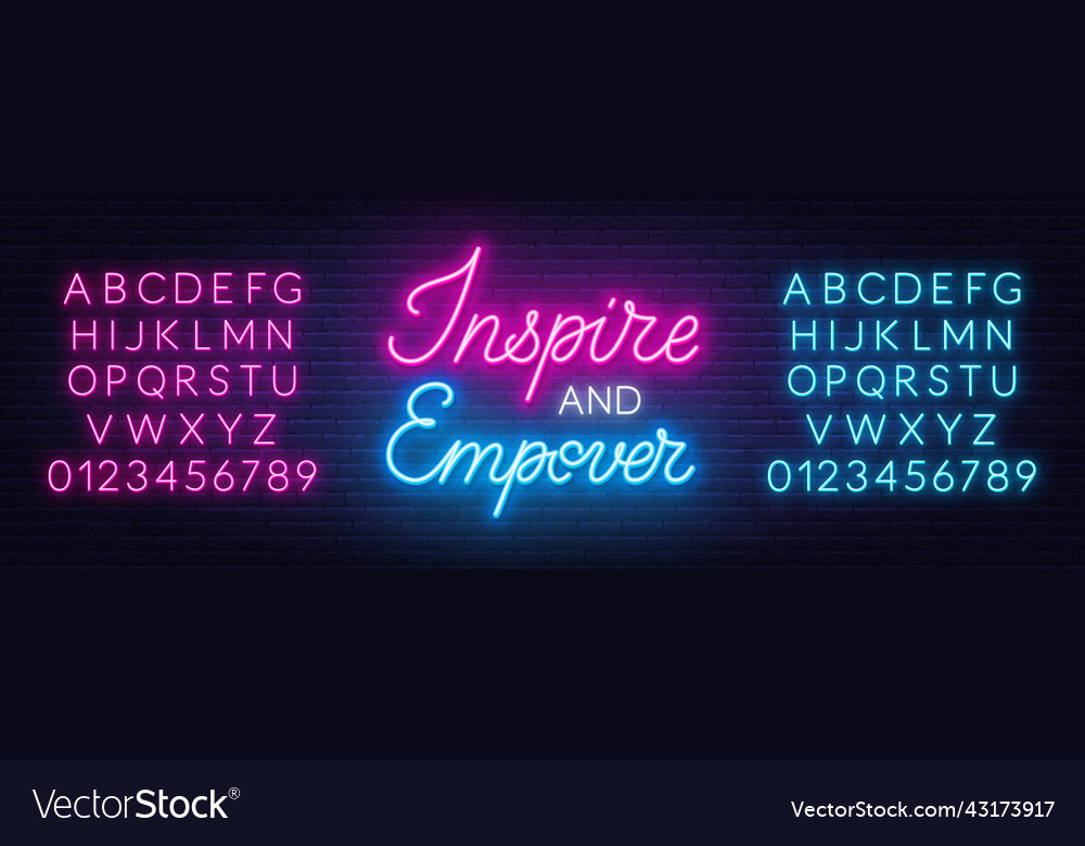 Inspire and empower neon sign on brick wall