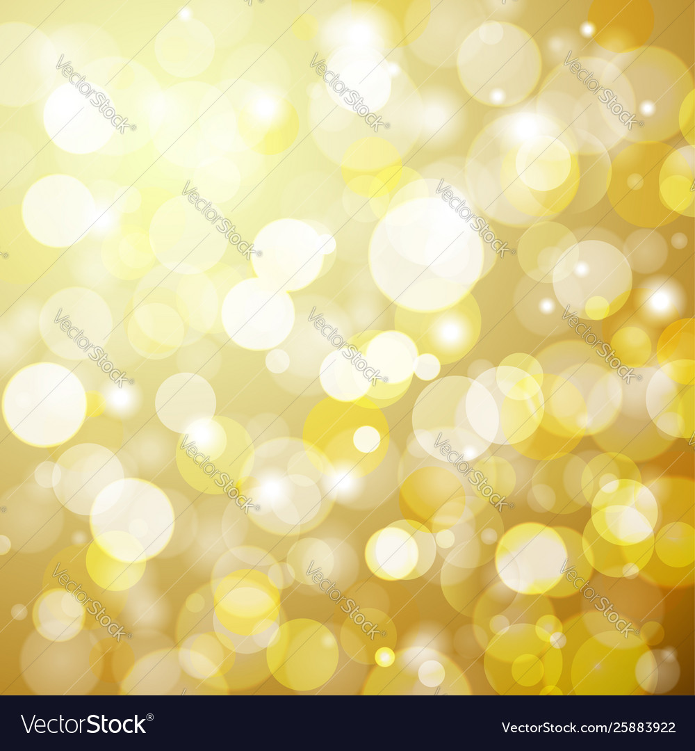 Abstract golden bokeh background with a light