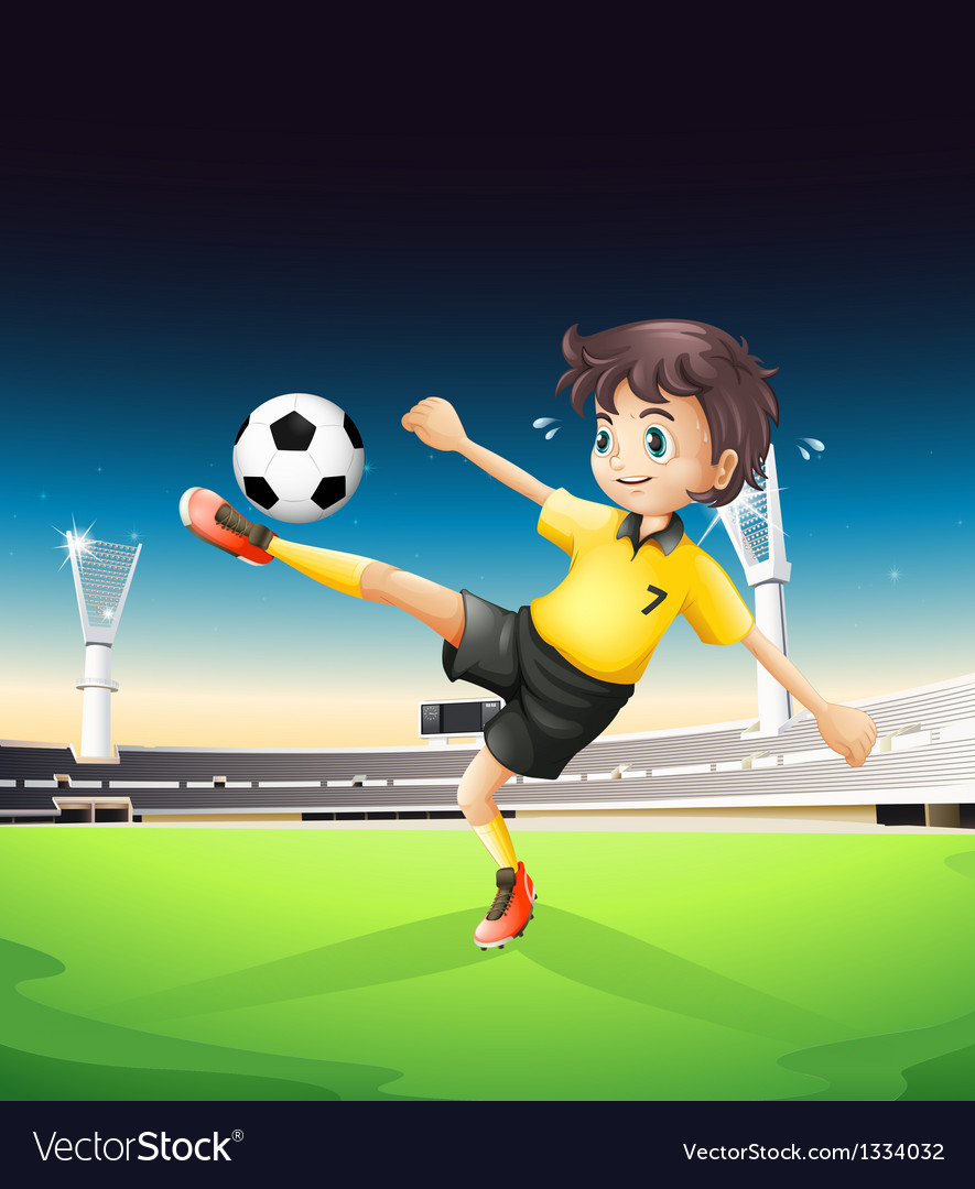 A boy in a yellow uniform playing soccer in the Vector Image