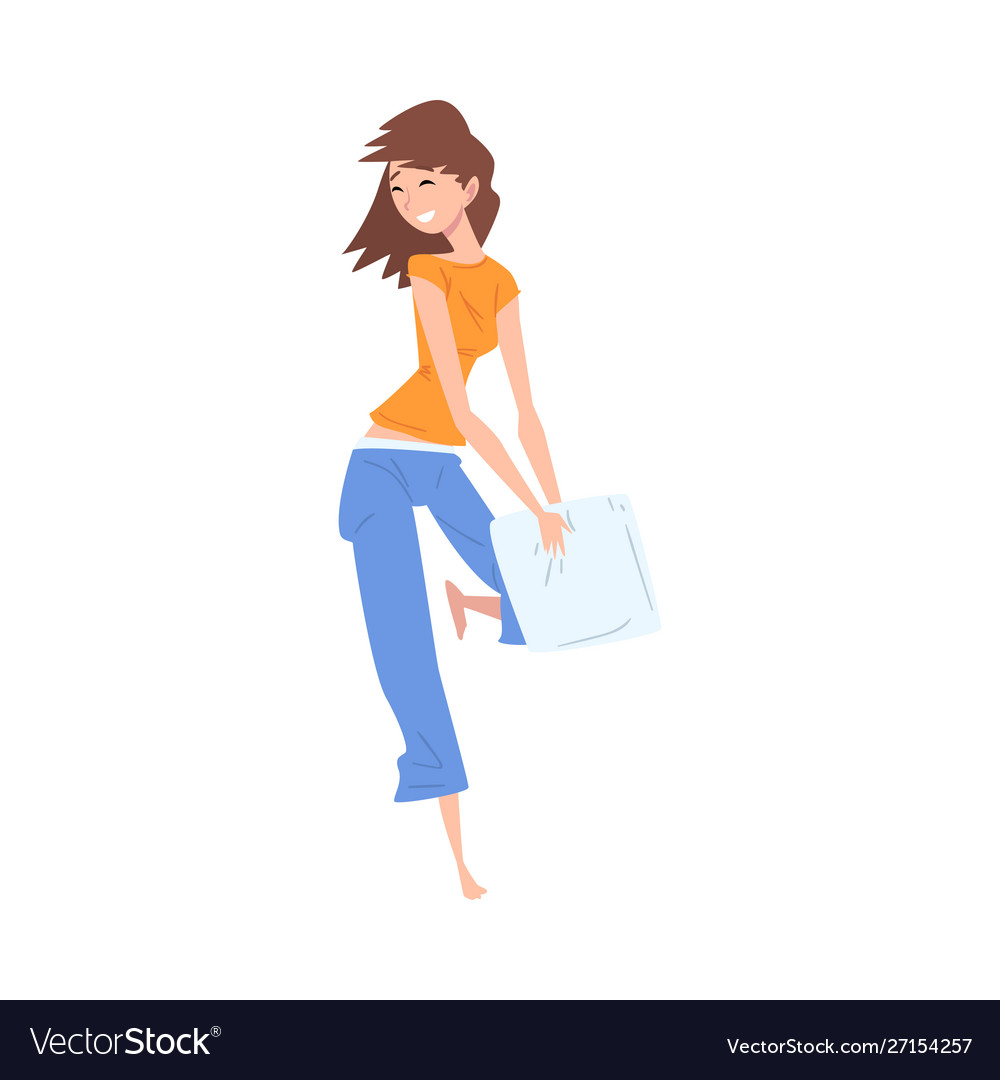 Happy girl in pajama playing pillow fight Vector Image