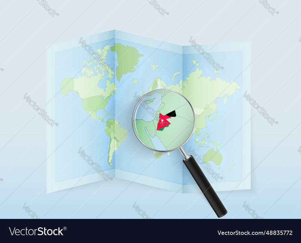 A folded world map with magnifying lens