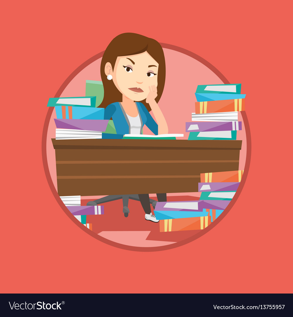 Student sitting at the table with piles of books