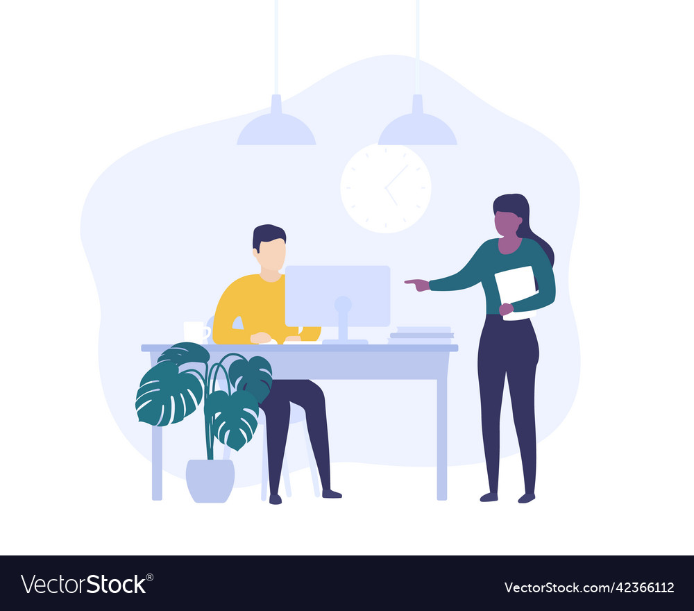 Supervisor and employe working at computer