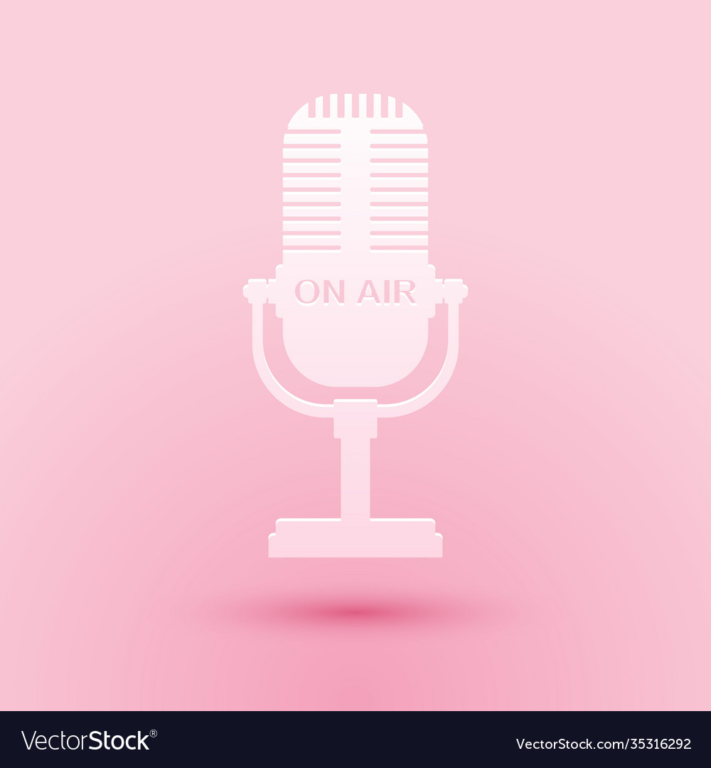 Paper cut microphone icon isolated on pink