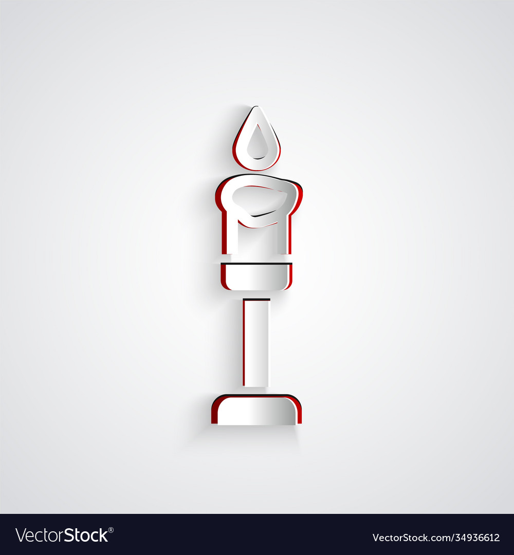 Paper cut burning candle icon isolated on grey