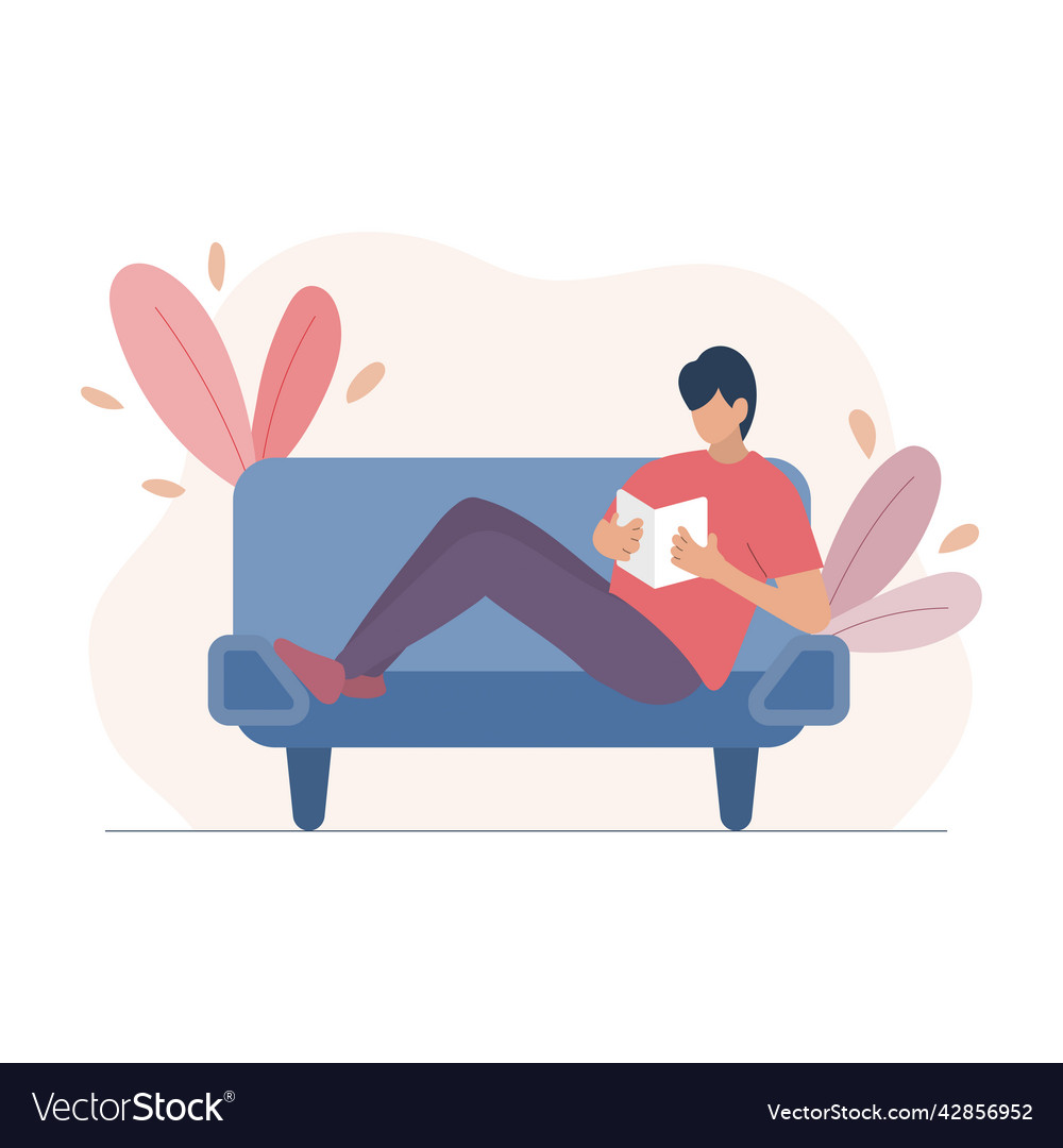Man sitting on a sofa and reading book