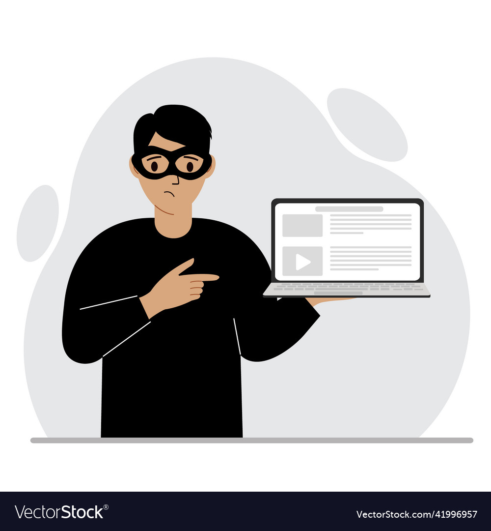 Hacker in a black mask with computer