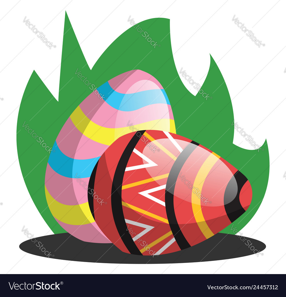 Two easter eggs with a pattern in grass web