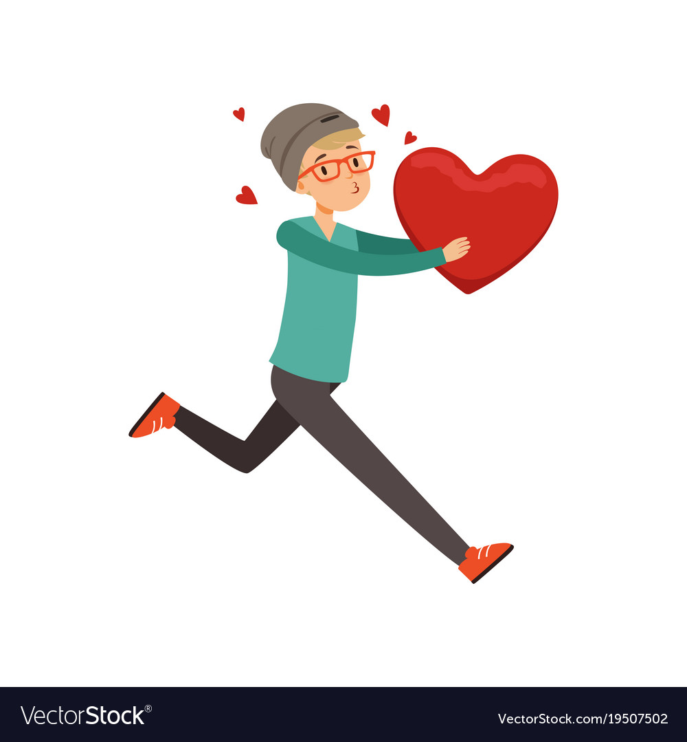 Happy teen boy running with red heart