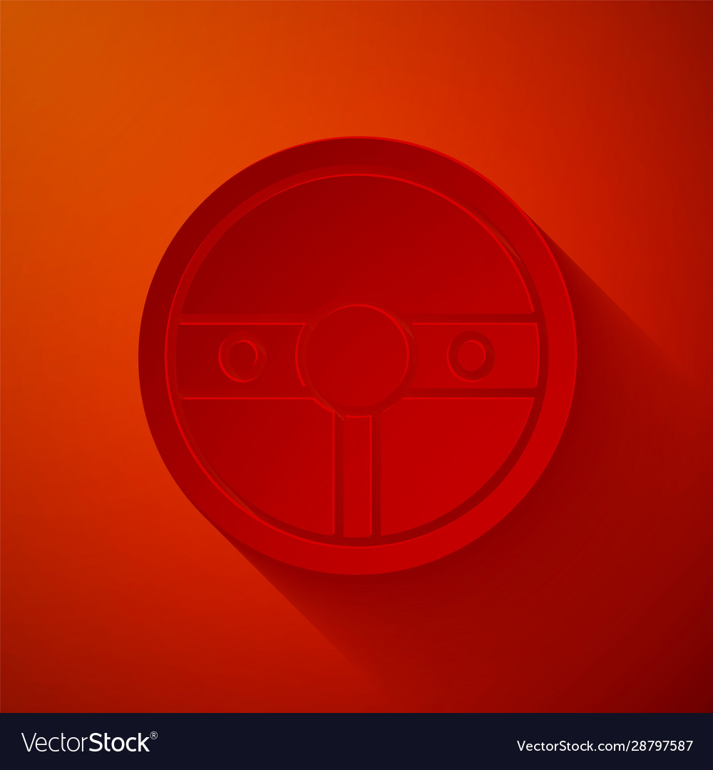 Paper cut steering wheel icon isolated on red