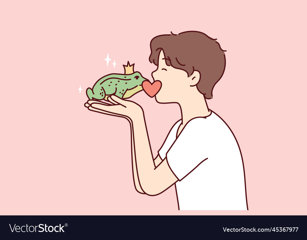 Guy kisses frog princess with crown on head