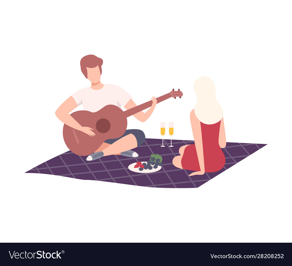 Couple having picnic in park man and woman