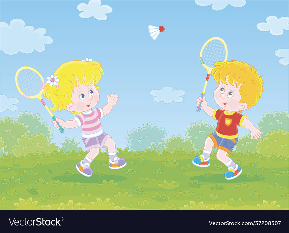 Happy little kids playing badminton