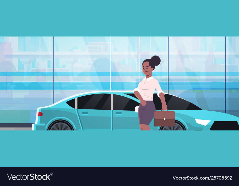 Businesswoman standing near luxury car african