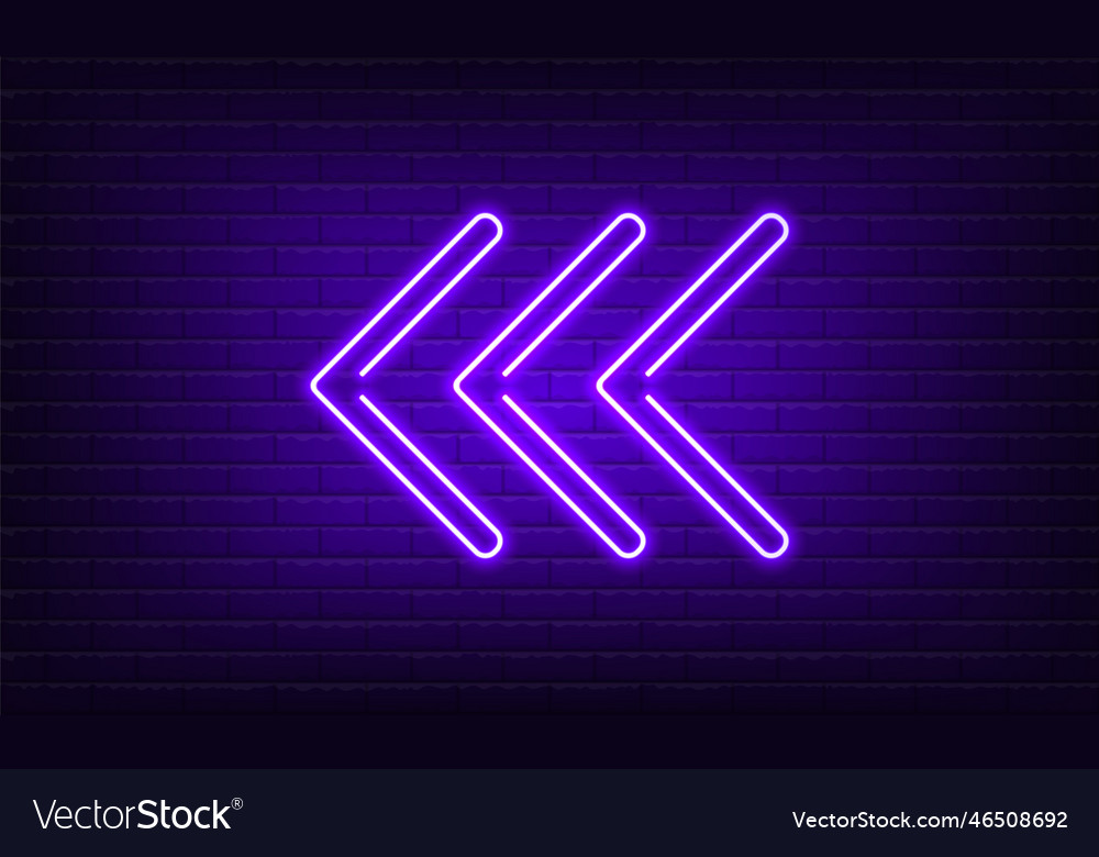 Neon sign arrow left purple on brick wall