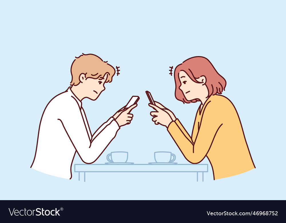 Couple with phones sits in cafe addiction