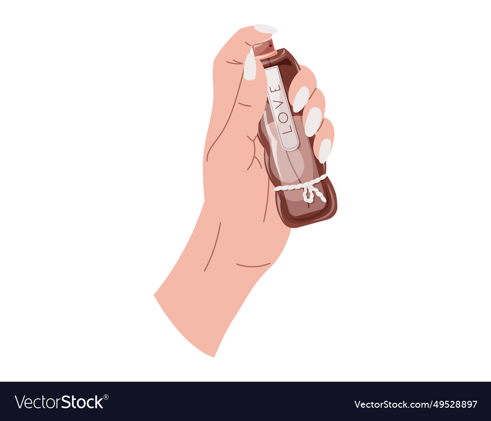 Elegant female hands with manicure holding a glass