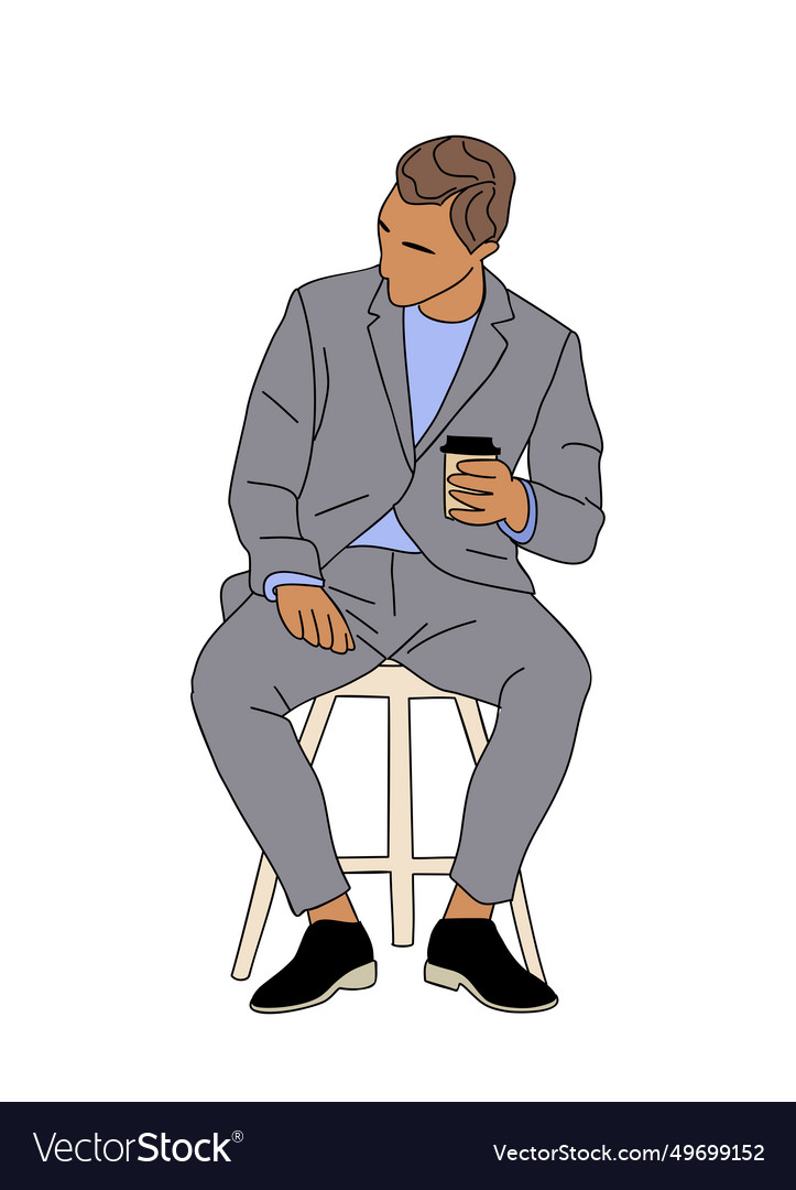 Businessman sitting on office chair holding coffee