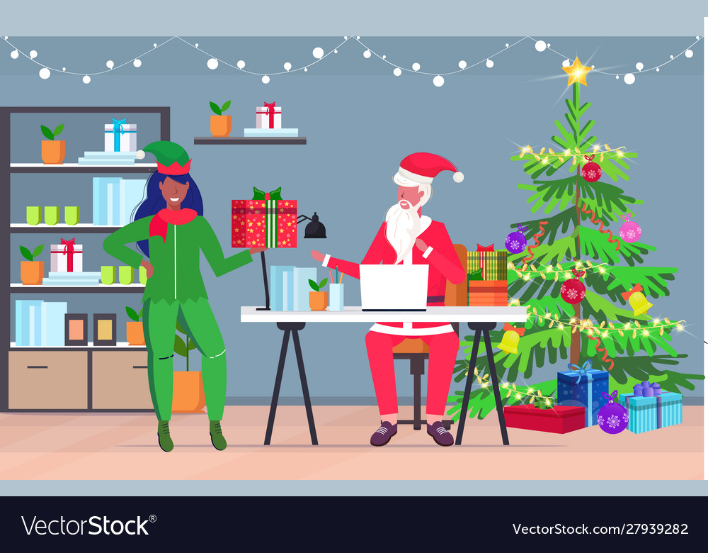 Santa claus using laptop african american female Vector Image