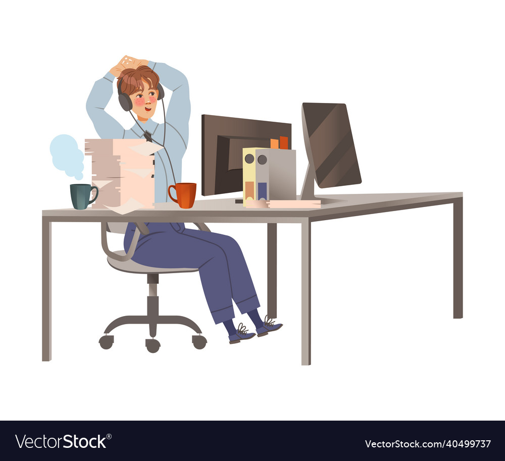 Office worker in headphones sitting at desk