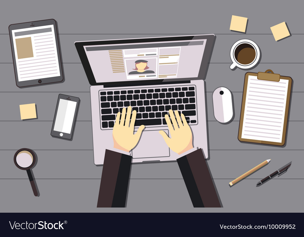 Hands typing text on the laptop keyboard and using