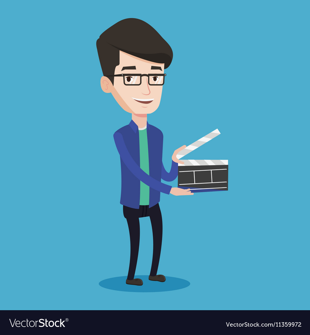 Smiling man holding an open clapperboard