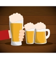 hand hold beer glass mug wit foam on table vector image