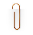 realistic copper paperclip attached to paper vector image