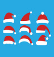 set of christmas hats isolated on blue background vector image vector image