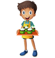 a young boy holding tray with cupcakes vector image