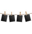 retro photo frames hanging on rope isolated vector image vector image