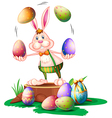 a bunny juggling the easter eggs vector image vector image