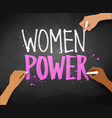 female hands writing women power slogan vector image