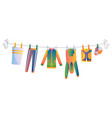 various items baby clothes on rope isolated vector image vector image