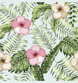 green tropical leaves and pink hibiscus seamless vector image