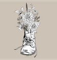 flowers in an old tattered shoe vector image vector image