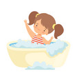 cute happy little girl in swimsuit taking bath vector image