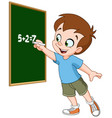 Cartoon school boy writing on the blackboard Vector Image