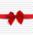 red gift bow with ribbon on polka dot background vector image