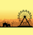 at sunset amusement park scenery silhouette vector image