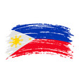 philippines flag in grunge brush stroke vector image