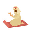 muslim man in traditional clothes on rag prays vector image