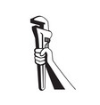 hand of plumber holding up pipe wrench retro vector image vector image