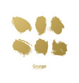 set of golden paint brush strokes - gold brush vector image