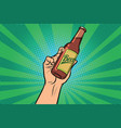 beer bottle in hand vector image